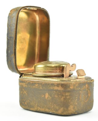 Lot 34 - VICTORIAN BRASS AND LEATHER CASED TRAVELLING INKWELL
