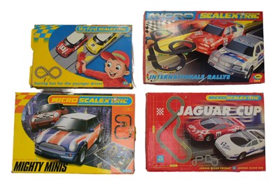 Lot 336 - SCALEXTRIC - FOUR MICRO SCALEXTRIC SLOT CAR RACING SETS