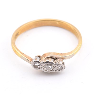 Lot 113 - 18CT GOLD & DIAMOND THREE STONE CROSSOVER RING