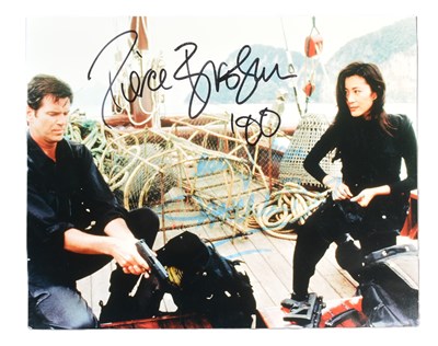 Lot 254 - PIERCE BROSNAN & MICHELLE YEOH - TOMORROW NEVER DIES (1997) SIGNED 8X10" - UACC