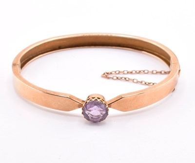 Lot 5 - 15CT GOLD & AMETHYST BANGLE