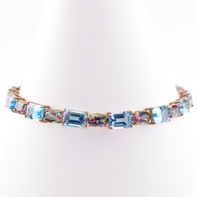 Lot 109 - HALLMARKED 9CT GOLD SWISS BLUE & MYSTIC TOPAZ LINE BRACELET