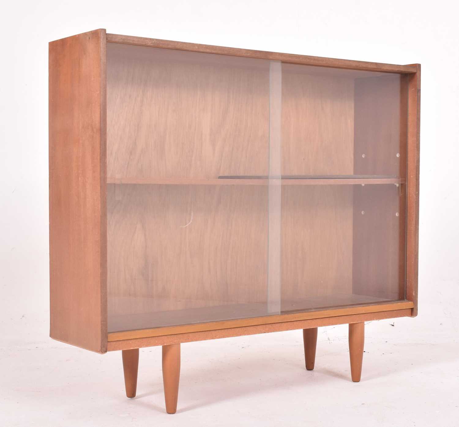 Lot 587 - BRITISH MODERN DESIGN - RETRO MID CENTURY TEAK & GLASS BOOKCASE CABINET
