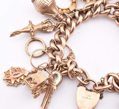 Lot 18 - HALLMARKED 9CT GOLD CHARM BRACELET