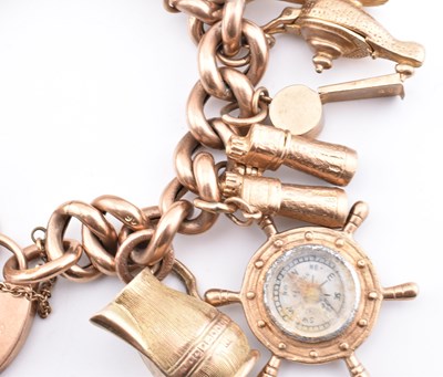 Lot 18 - HALLMARKED 9CT GOLD CHARM BRACELET