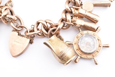 Lot 18 - HALLMARKED 9CT GOLD CHARM BRACELET