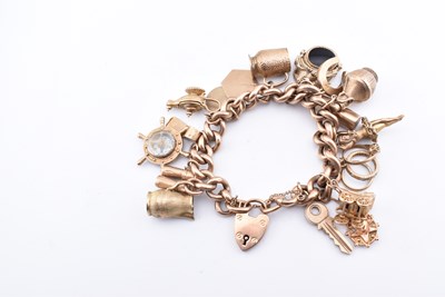 Lot 18 - HALLMARKED 9CT GOLD CHARM BRACELET