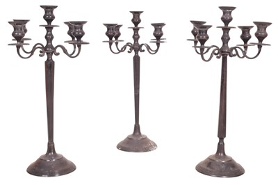 Lot 512 - SET OF THREE LARGE SILVER-TONED FIVE BRANCH CANDELABRAS