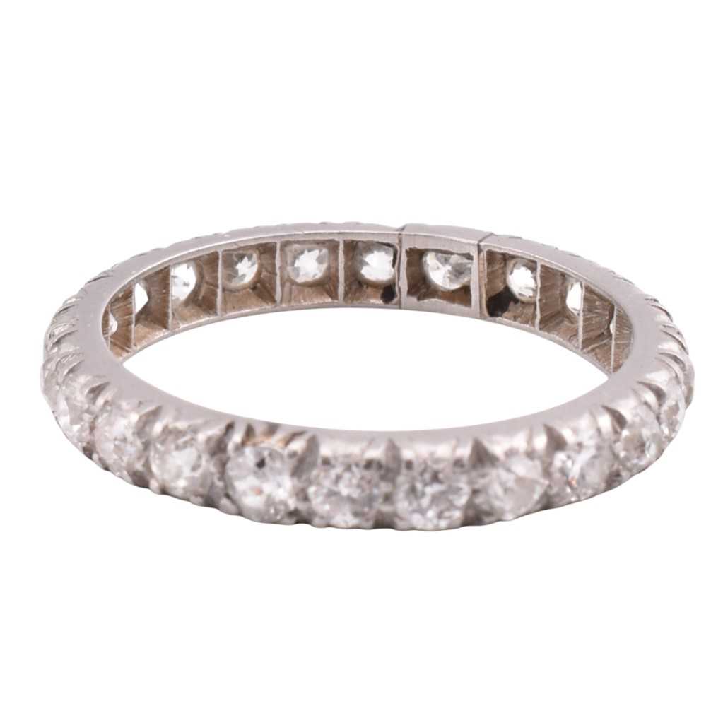 Lot 106 - PLATINUM & GOLD DIAMOND ETERNITY RING