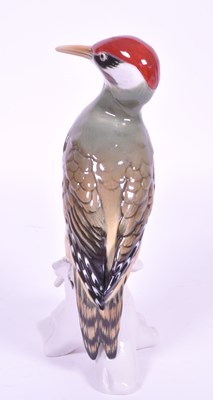 Lot 19 - KARL ENS - 20TH CENTURY PORCELAIN WOODPECKER FIGURE