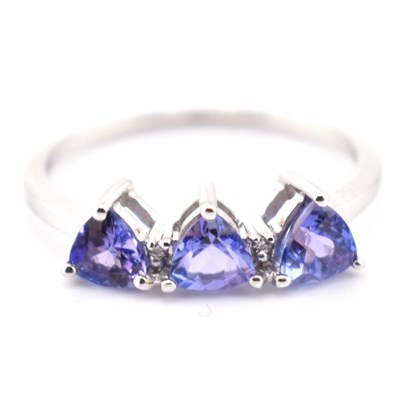 Lot 83 - HALLMARKED 9CT WHITE GOLD & TANZANITE THREE STONE RING