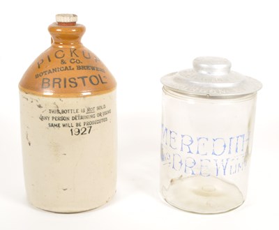 Lot 66 - 19TH CENTURY MEREDITH & DREW GLASS JAR AND 1927 STONEWARE FLAGON