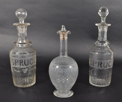 Lot 73 - THREE LATE 19TH CENTURY CLEAR GLASS DECANTERS
