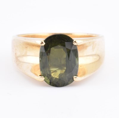 Lot 175 - 18CT GOLD & GREEN SAPPHIRE MODERNIST RING