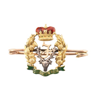 Lot 356 - GOLD & METAL SEAFORTH HIGHLANDERS REGIMENTAL CAP BADGE