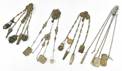 Lot 77 - COLLECTION OF FOUR EARLY 20TH CENTURY METAL CHATELAINES