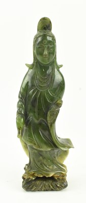 Lot 142 - A KHOTAN / HOTAN / HETIAN GREEN JADE FIGURE OF A GUANYIN 清和田青玉观音