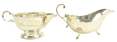 Lot 94 - TWO 20TH CENTURY GEORGE V HALLMARKED SILVER GRAVY / SAUCE BOATS