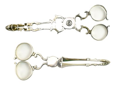 Lot 31 - TWO PAIRS OF GEORGE III HALLMARKED SILVER SUGAR NIPS