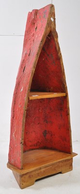 Lot 631 - A 20TH CENTURY BALINESE CANOE PLANT STAND / SHELF