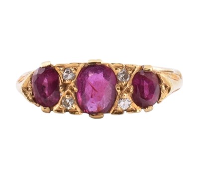 Lot 42 - 18CT GOLD RUBY & DIAMOND THREE STONE RING