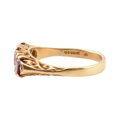 Lot 42 - 18CT GOLD RUBY & DIAMOND THREE STONE RING