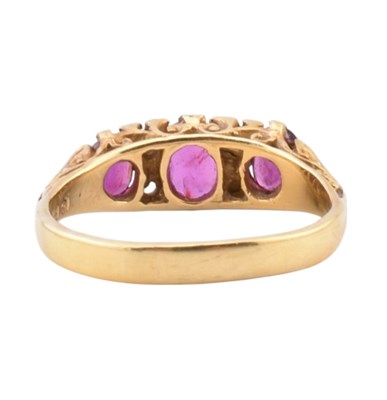 Lot 42 - 18CT GOLD RUBY & DIAMOND THREE STONE RING