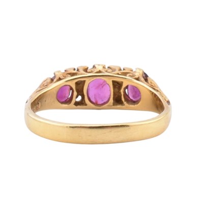 Lot 42 - 18CT GOLD RUBY & DIAMOND THREE STONE RING