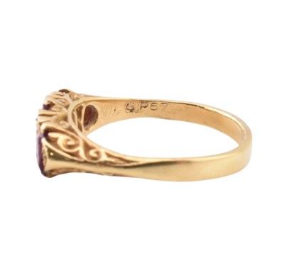 Lot 42 - 18CT GOLD RUBY & DIAMOND THREE STONE RING