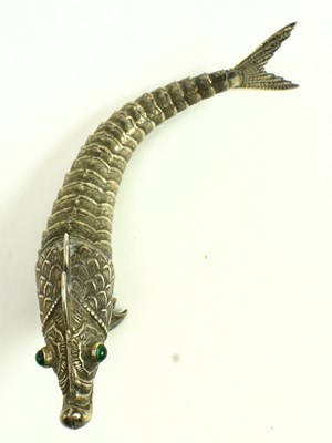 Lot 88 - A 20TH CENTURY SPANISH SILVER ARTICULATED FISH WITH EMERALD GLASS EYES