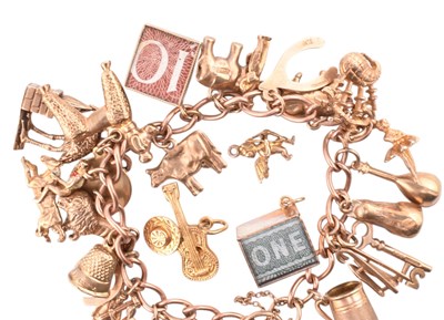 Lot 70 - HALLMARKED 9CT GOLD CHARM BRACELET & FOUR LOOSE CHARMS