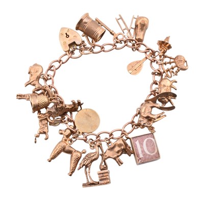 Lot 70 - HALLMARKED 9CT GOLD CHARM BRACELET & FOUR LOOSE CHARMS