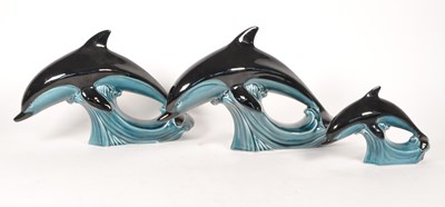 Lot 66 - POOLE POTTERY - THREE LATE 20TH CENTURY GRADUATING DOLPHINS