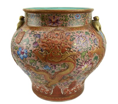 Lot 165 - REPUBLIC RED GROUND POLYCHROME ENAMELLED JAR / POT 民国 乾隆款珐琅彩万花描金双耳缸