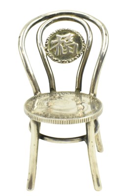 Lot 55 - CHINESE SILVER MINIATURE CHAIR WITH KWANG TUNG CASH COIN