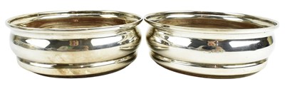 Lot 69 - TWO 20TH CENTURY HALLMARKED SILVER WINE COASTERS
