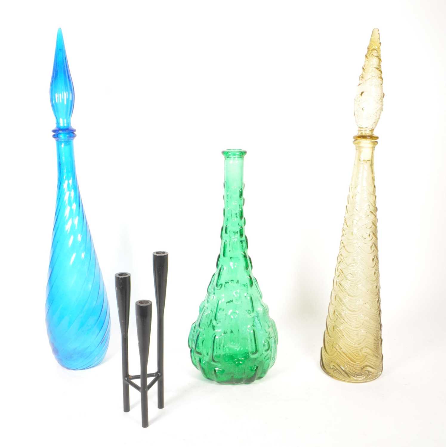 Lot 108 - THREE MID CENTURY COLOURED GLASS GENIE BOTTLES WITH METAL CANDLESTICK HOLDER