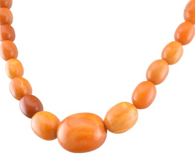 Lot 112 - EGG YOLK AMBER BEAD NECKLACE