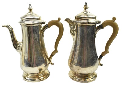 Lot 6 - TWO GEORGE V HALLMARKED SILVER COFFEE POTS / WATER POTS
