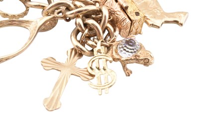 Lot 75 - HALLMARKED 9CT GOLD CHARM BRACELET