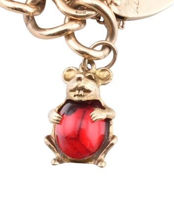 Lot 75 - HALLMARKED 9CT GOLD CHARM BRACELET