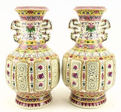 Lot 268 - PAIR OF 20TH CENTURY FAMILLE ROSE RETICULATED VASES 二十世纪粉彩花卉瓶一对