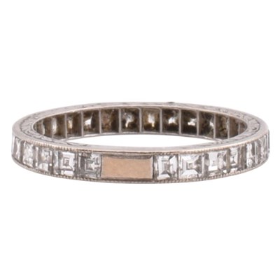 Lot 109 - PLATINUM GOLD & DIAMOND ETERNITY RING