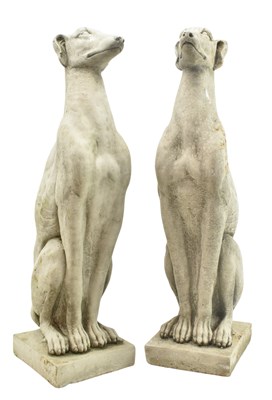 Lot 559 - PAIR OF 20TH CENTURY COMPOSITE GARDEN DECORATIVE DOG FIGURES