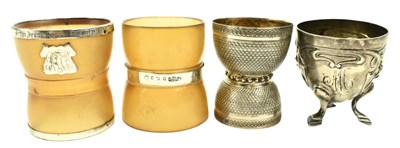 Lot 91 - TWO GEORGE V HORN & SILVER EGG CUPS & TWO SILVER EGG CUPS