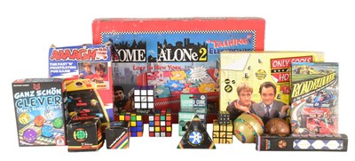 Lot 760 - RETRO GAMES - HOME ALONE 2 BOARD GAME & COLLECTION OF RUBIK'S CUBE PUZZLES