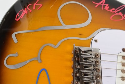 Lot 1 - OASIS (ENGLISH ROCK BAND) - RARE FULL BAND SIGNED GUITAR - AFTAL