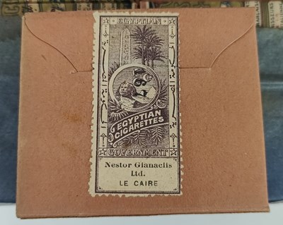 Lot 15 - TOBACCIANA. EDWARDIAN IRON BOX OF ORIGINAL NESTOR CIGARETTE BOXES WITH CONTENTS