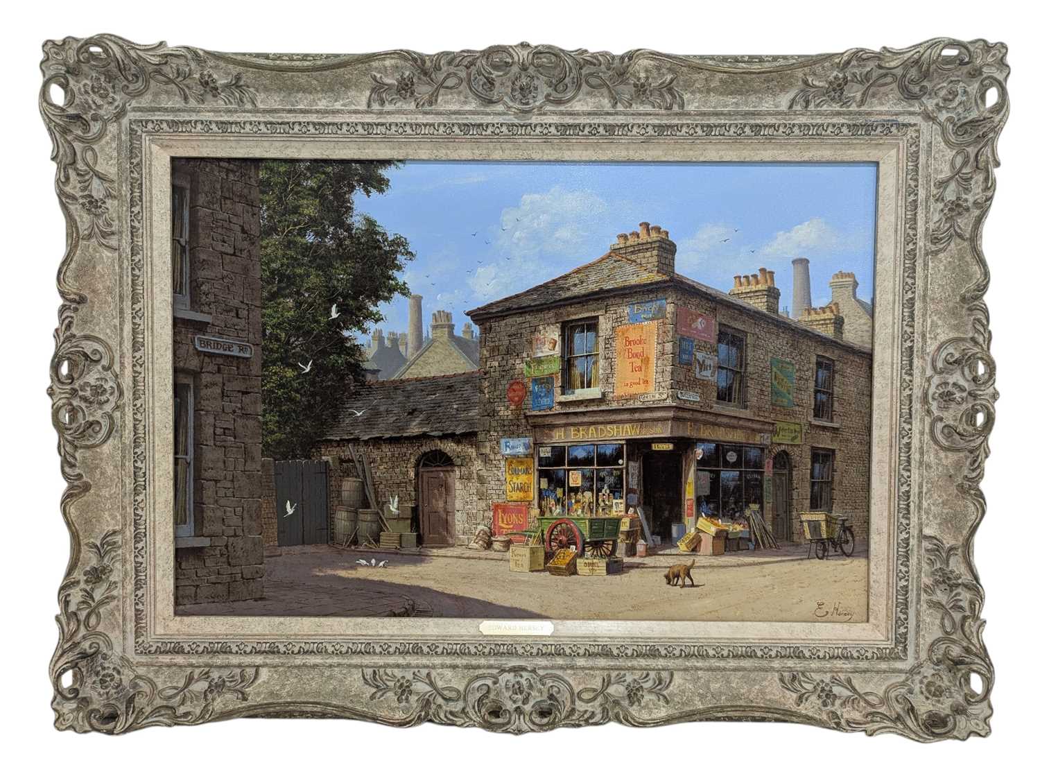 Lot 250 - EDWARD HERSEY (B. 1948) - ACRYLIC ON CANVAS STREET SCENE WITH ENAMEL SIGNS