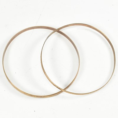 Lot 147 - TWO HALLMARKED 9CT GOLD ENGRAVED BANGLES